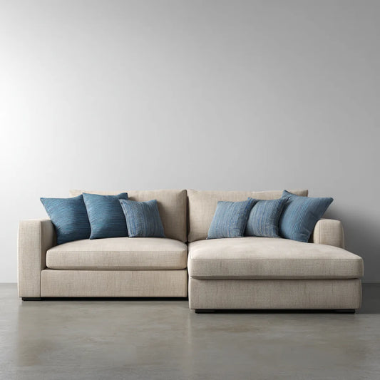 Canapé d'angle 3 places avec méridienne beige et coussins bleus 280 x 170 x 85 cm en polyester forme L